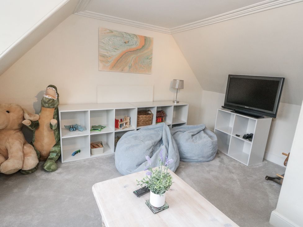 A game room with bean bags and a television at Rowan Tree House Brechin