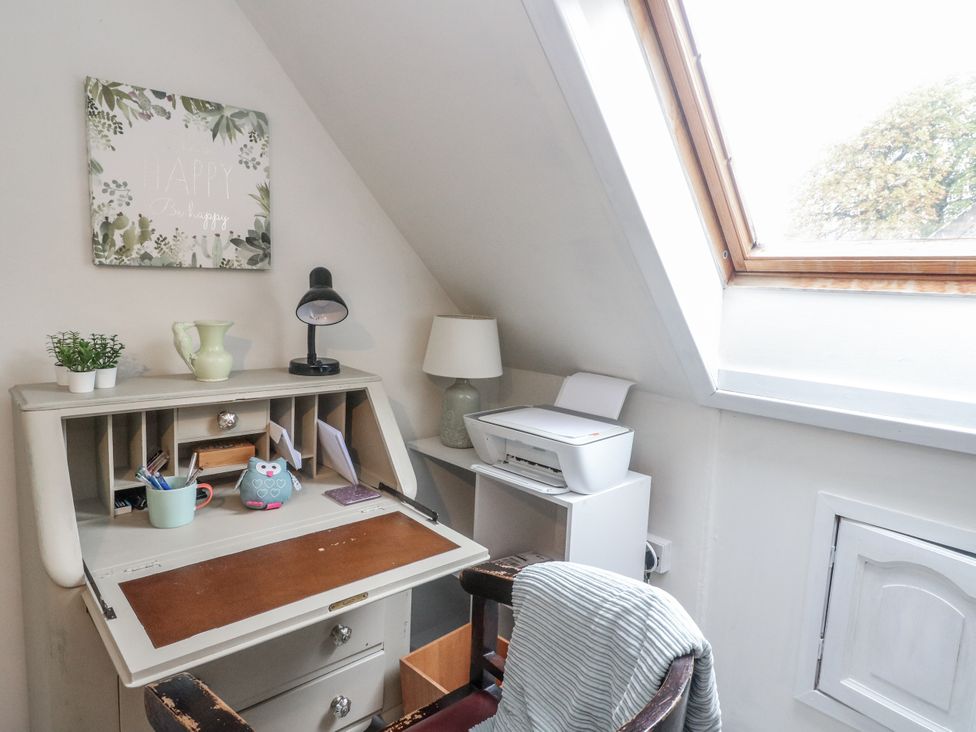 An office with a desk and lamp at Rowan Tree House in Brechin