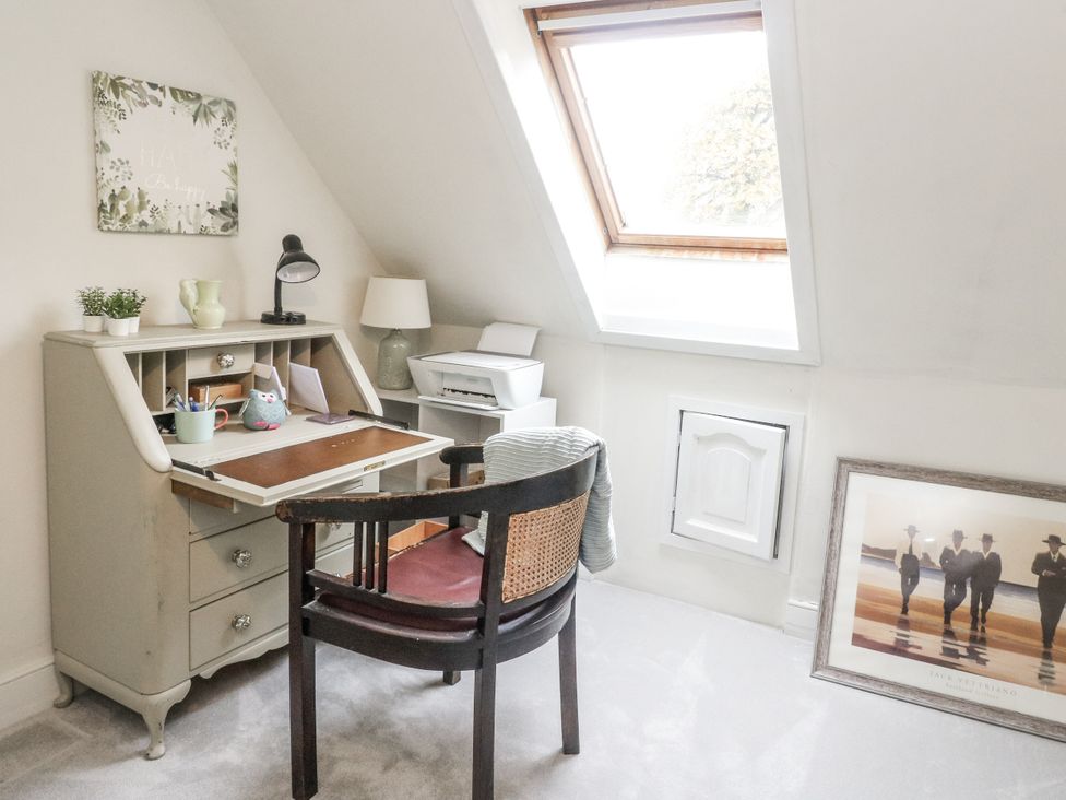 An office with a desk and chair at Rowan Tree House in Brechin