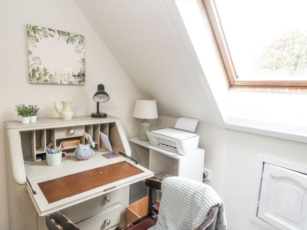 A home office with a desk and printer at Rowan Tree House Brechin