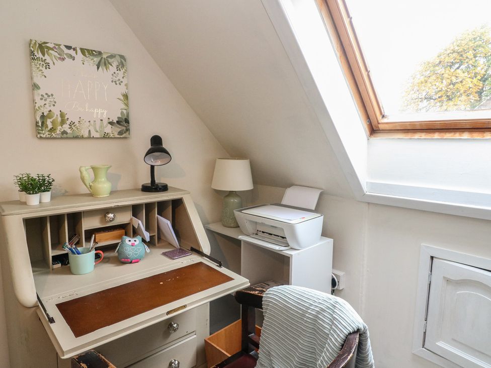 A study with a desk and printer at Rowan Tree House Brechin