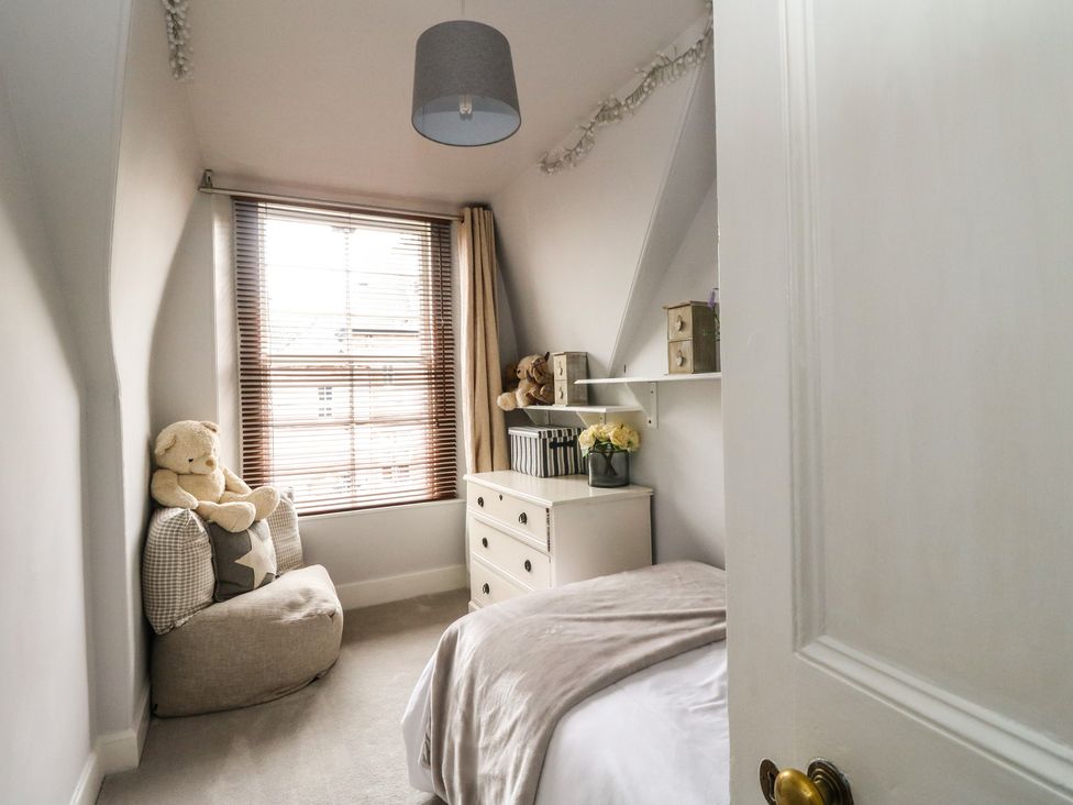 A bedroom with a bed and teddy bears at Rowan Tree House Brechin