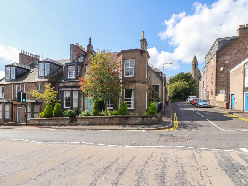 A street view with buildings and trees at Rowan Tree House Brechin