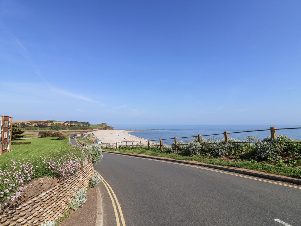 A coastal view with a road leading to the beach at Rushmoor Cottage in Colaton Raleigh