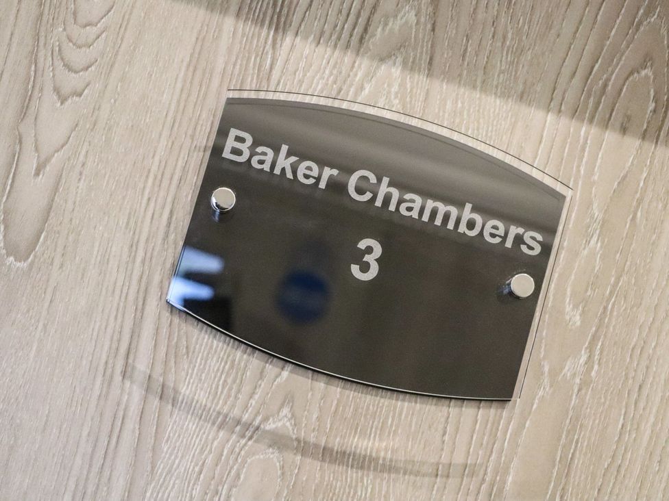 A nameplate displaying Baker Chambers 3