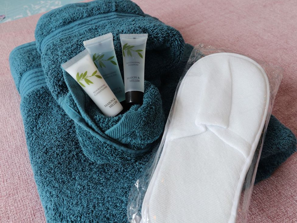 Bathroom accessories including towels and toiletries at Daniel Chambers in Camborne
