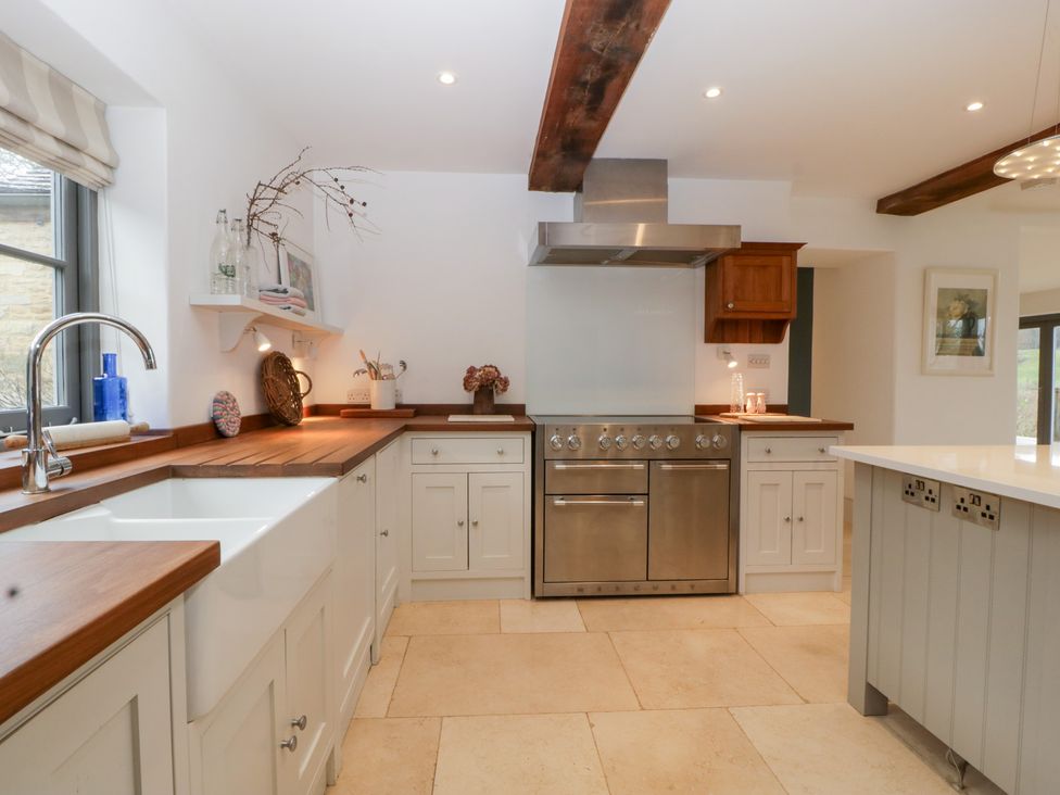 A kitchen with a sink and stove at Spring View in Tetbury