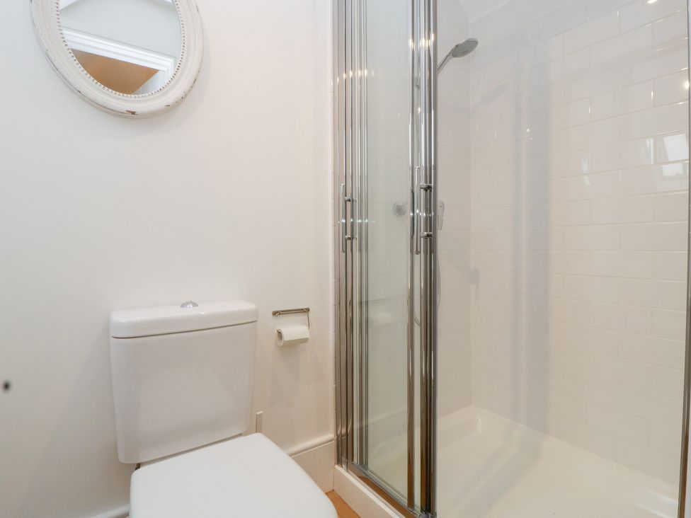 A bathroom with a toilet and a shower at Spring View in Tetbury