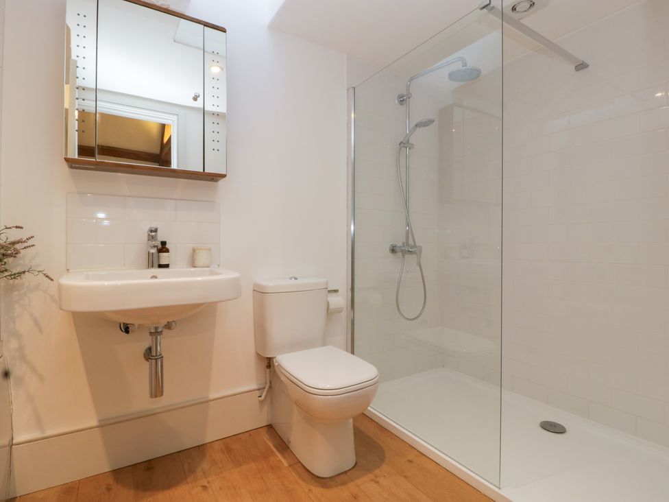 A bathroom with a sink, toilet, and shower at Spring View in Tetbury