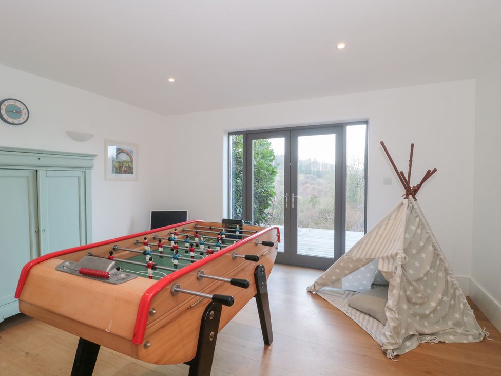A snug with a foosball table and a tent at Spring View, Kingscote, Gloucestershire