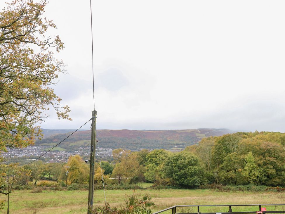 A view of hills and trees from an outdoor location at Glas Studio in Aberdare