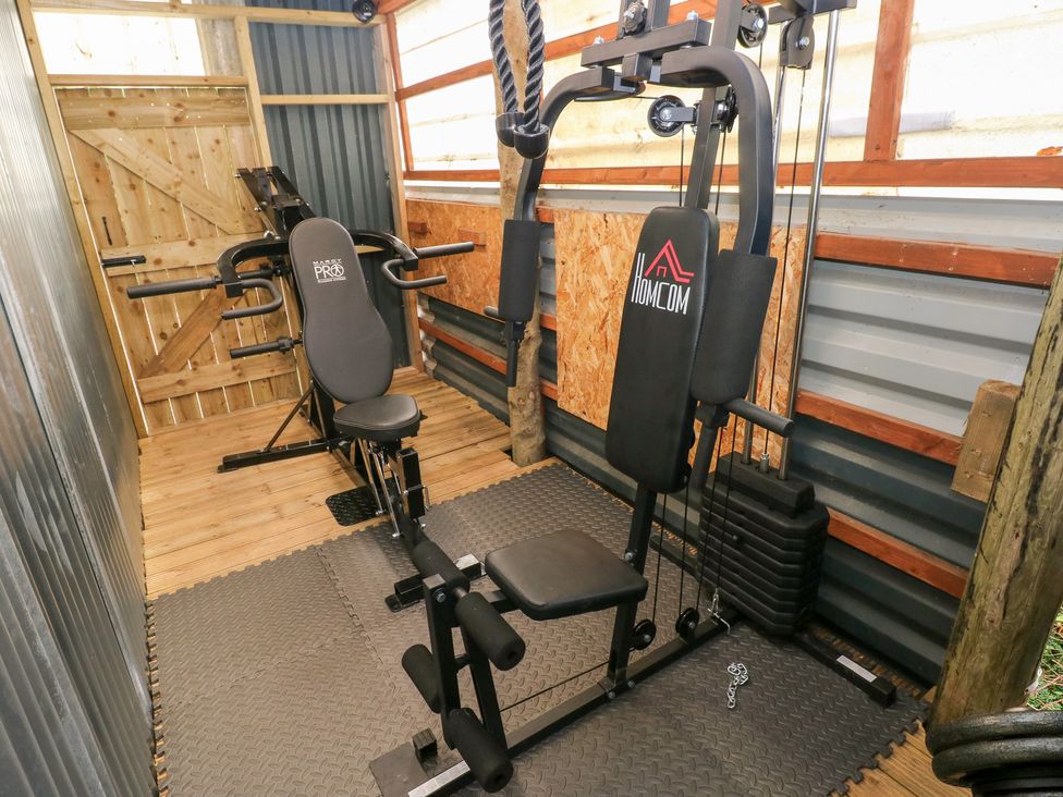 A gym with exercise equipment at Glas Studio in Aberdare