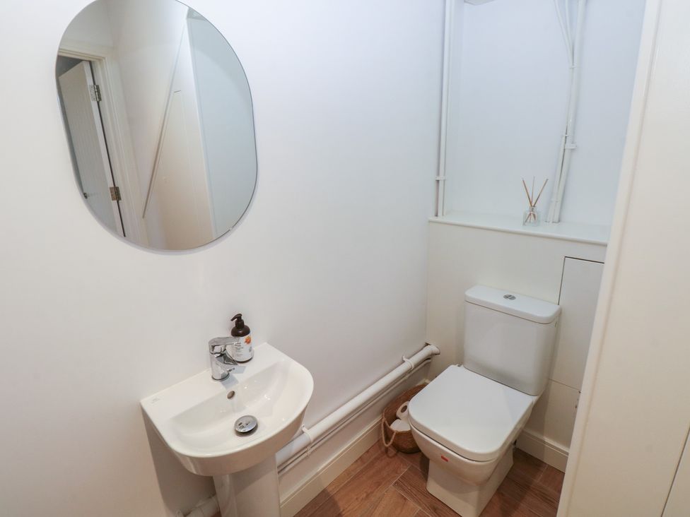 A bathroom with a sink and toilet at Awelfryn