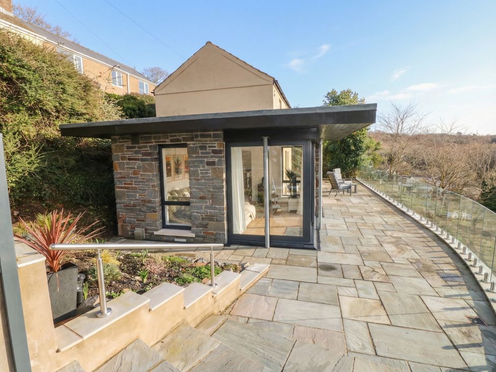 A house with a deck and garden space at Awelfryn in 
