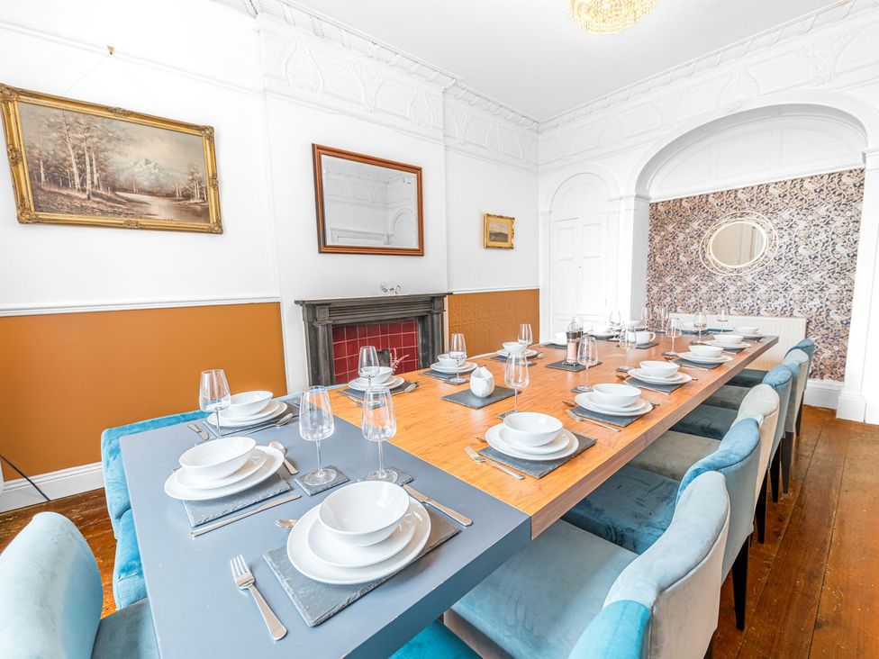 A dining room with a large dining table set at 8 Corkickle Whitehaven