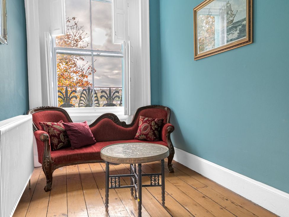 A sitting room with a sofa and a table at 8 Corkickle Whitehaven