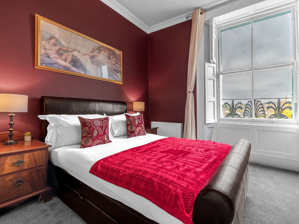 A bedroom with a bed and window at 8 Corkickle in Whitehaven