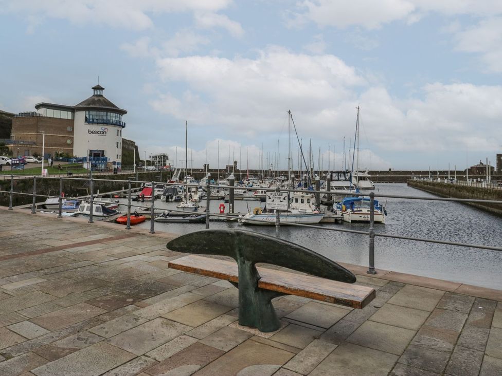A marina with boats and a building at 8 Corkickle Whitehaven