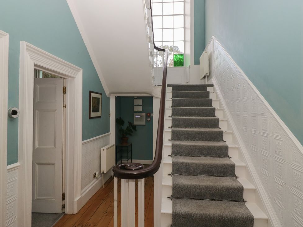 A staircase in a hallway at 8 Corkickle Whitehaven