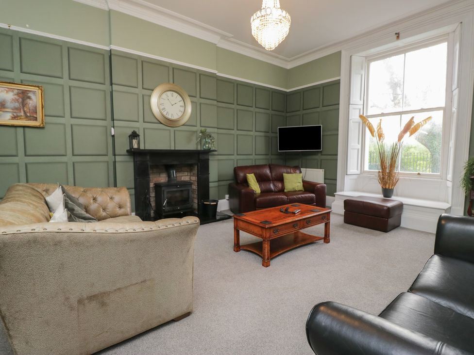 A living room with sofas and a coffee table at 8 Corkickle in Whitehaven