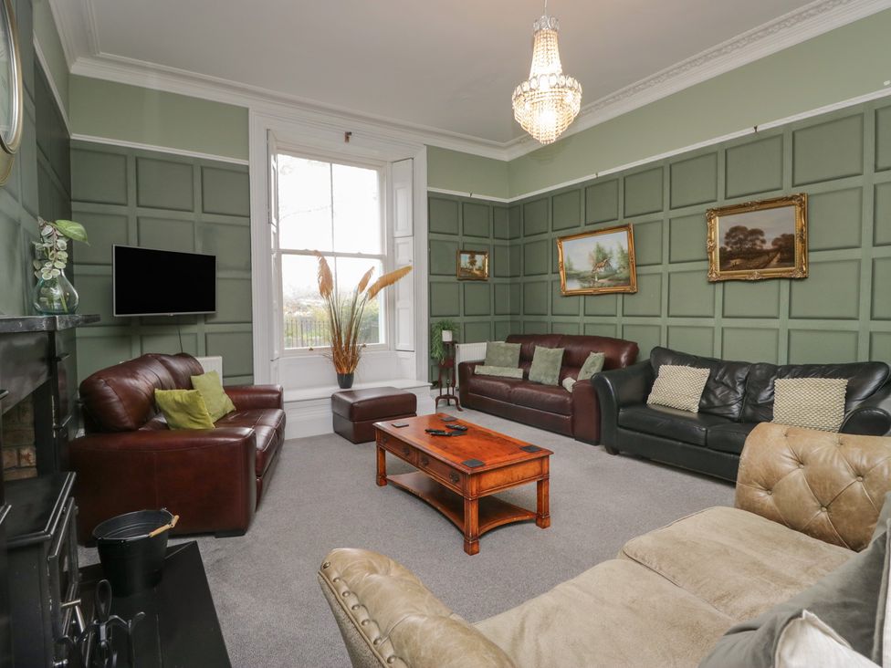 A living room with sofas and a coffee table at 8 Corkickle in Whitehaven