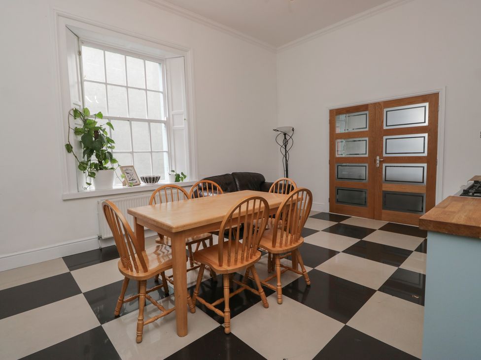 A dining room with a table and chairs at 8 Corkickle Whitehaven