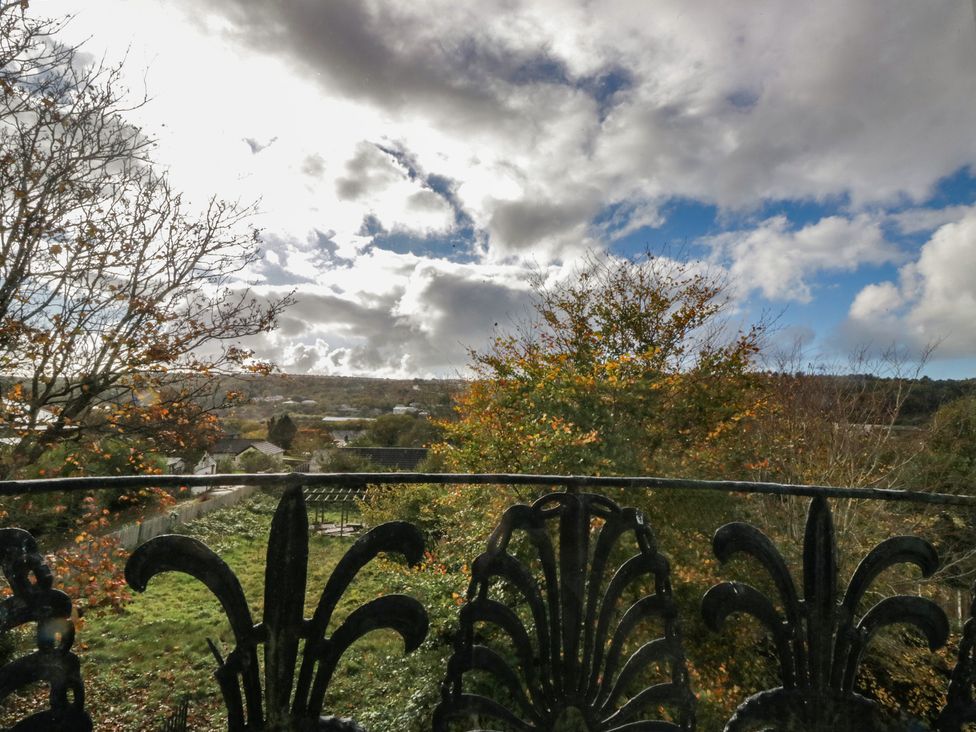 A view of trees and clouds from a railing at 8 Corkickle Whitehaven