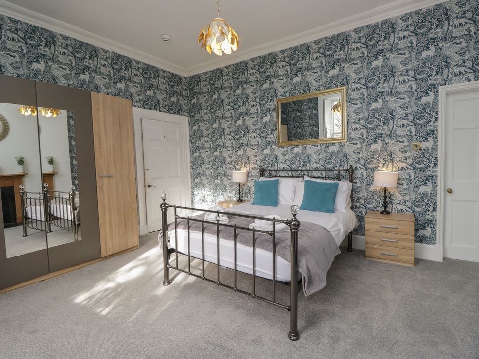 A bedroom with a bed and furniture at 8 Corkickle Whitehaven