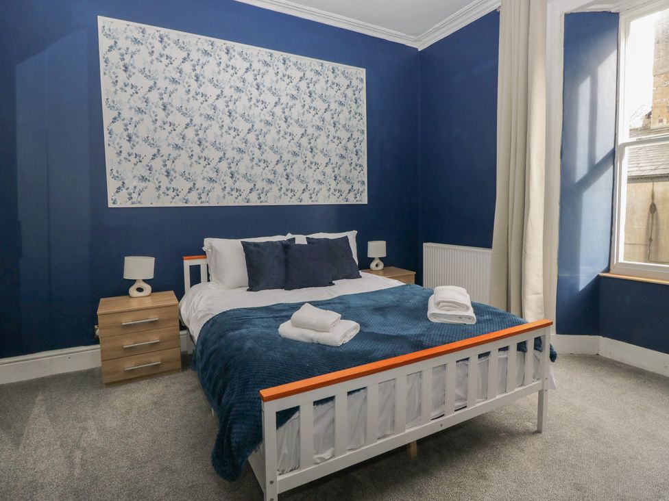 A bedroom with a bed and nightstand at 8 Corkickle Whitehaven