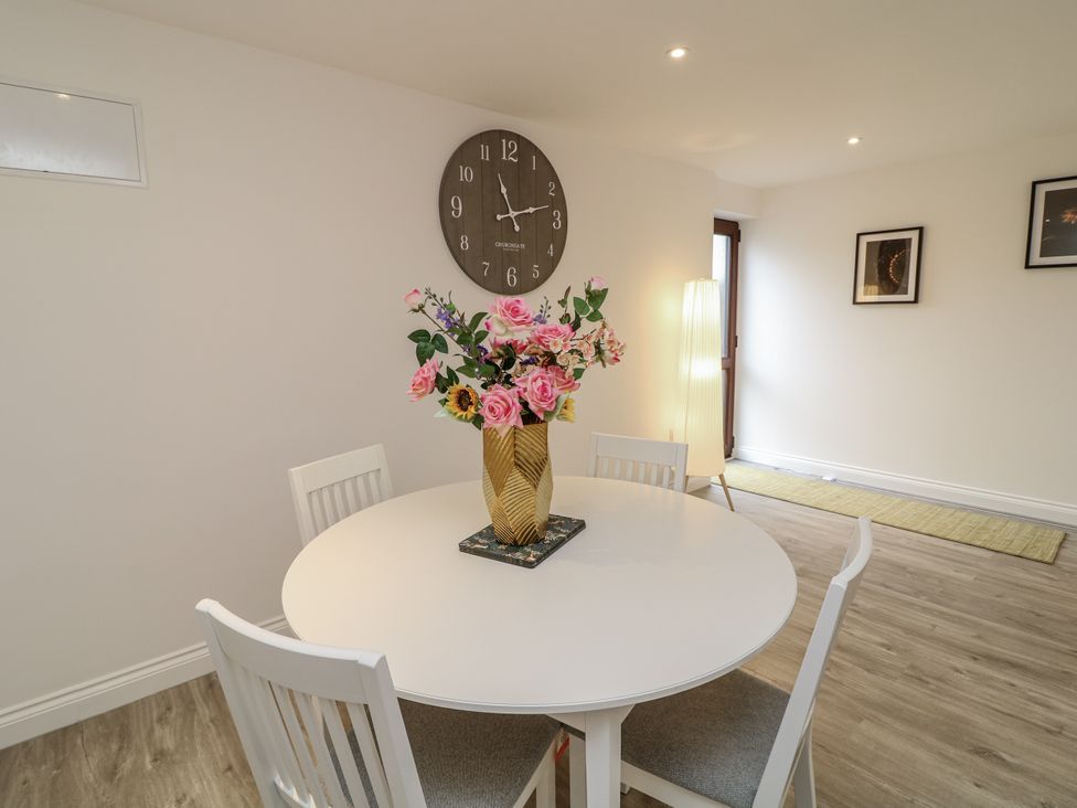 A dining room with a table and chairs at Station House in Scredington near Osbournby