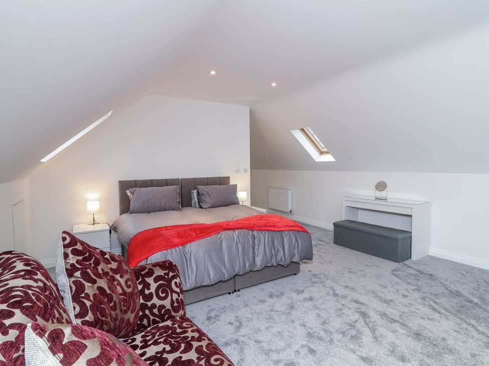 A bedroom with a bed and dresser at Station House in Scredington near Osbournby