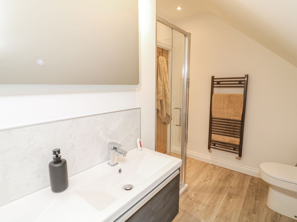 A bathroom with a sink and shower at Station House in Scredington near Osbournby