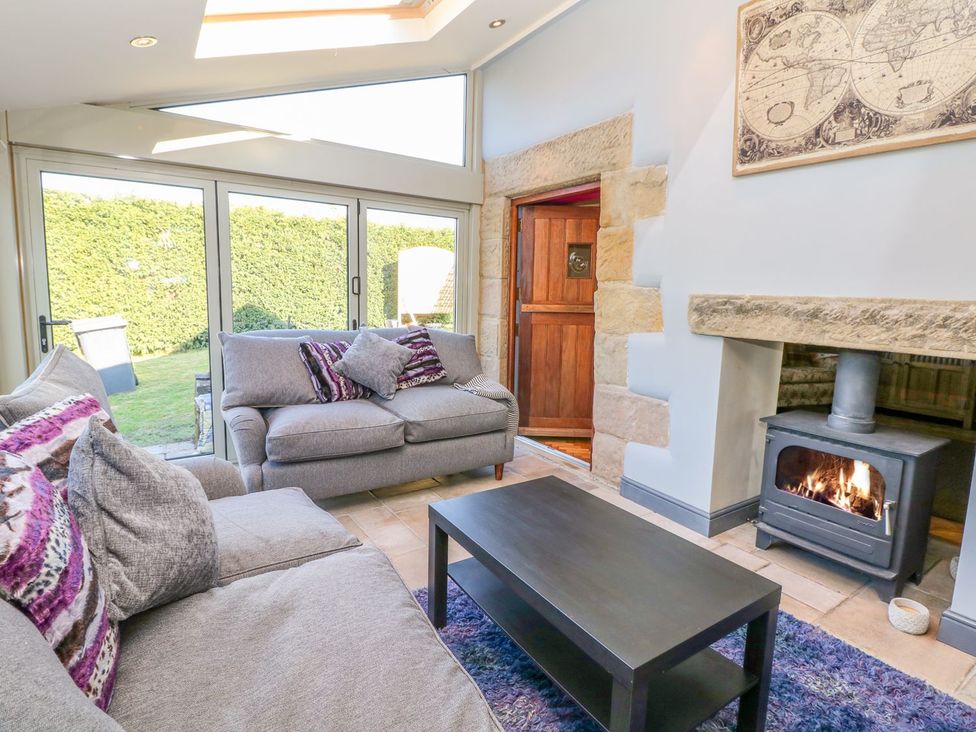 A living room with a sofa and coffee table at Peters Lea in Bakewell