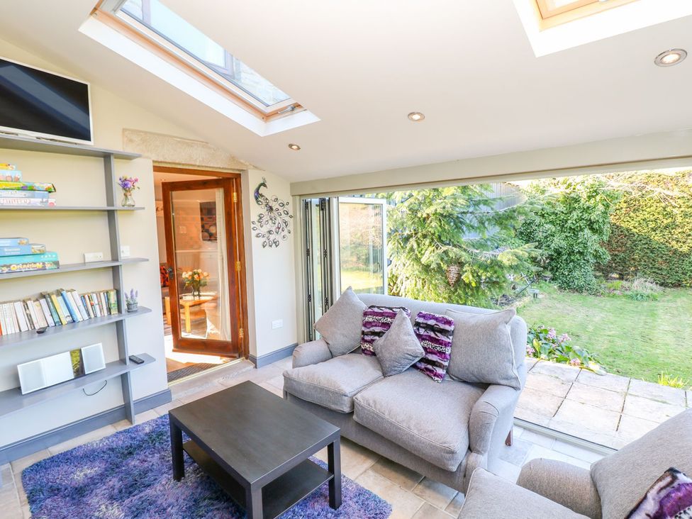 A snug with a sofa and coffee table at Peters Lea Bakewell