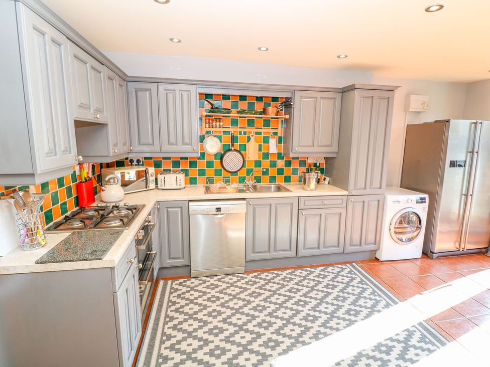 A kitchen with cabinets and appliances at Peters Lea Bakewell