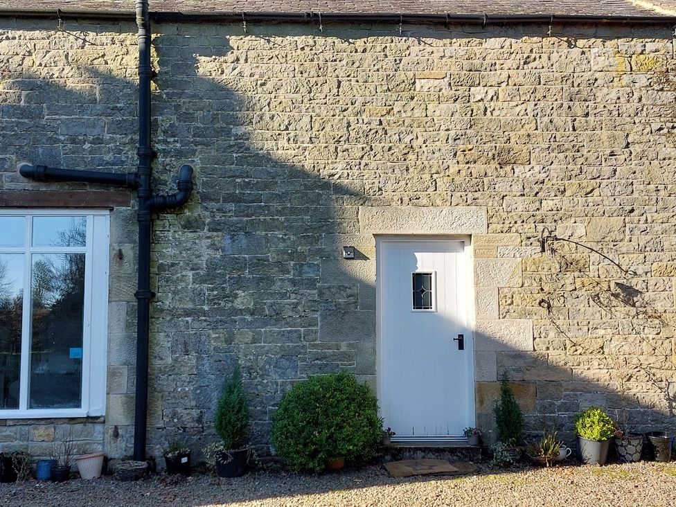 An exterior wall with a door and window at The Coach House- Canonbie near Langholm