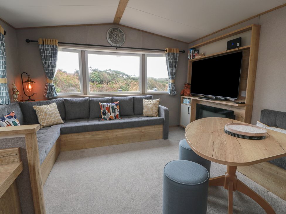 A living room with a sofa and television at Ellies House in Stranraer