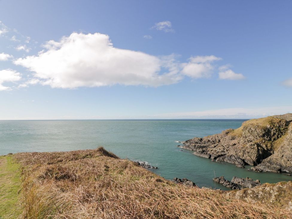 A view of the ocean and rocky shore at Ellies House in Stranraer