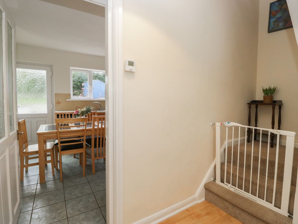 A hallway with dining area visible and a staircase at Castle Terrace in Penrith