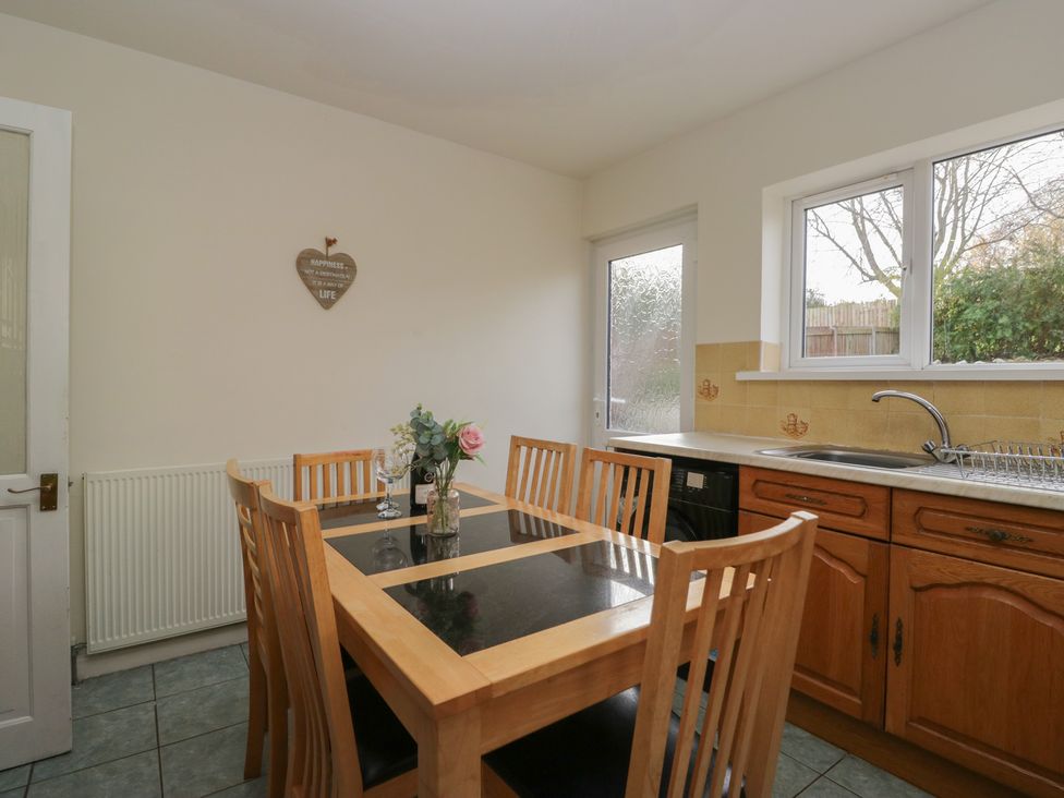 A kitchen with a dining table and sink at Castle Terrace in Penrith