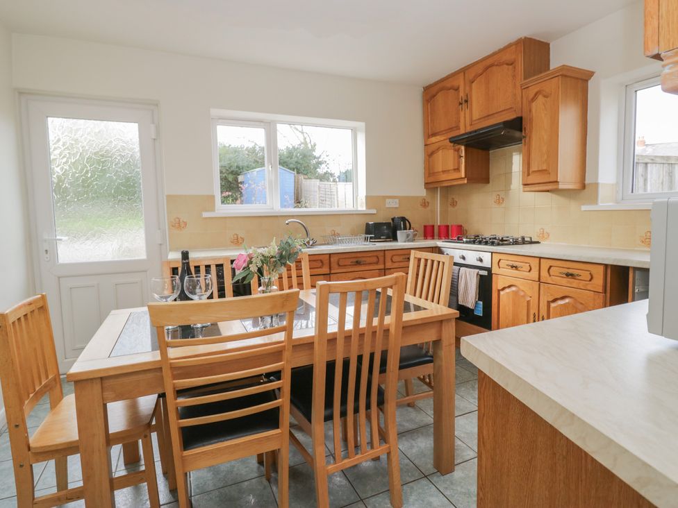 A kitchen with a table and chairs at Castle Terrace in Penrith