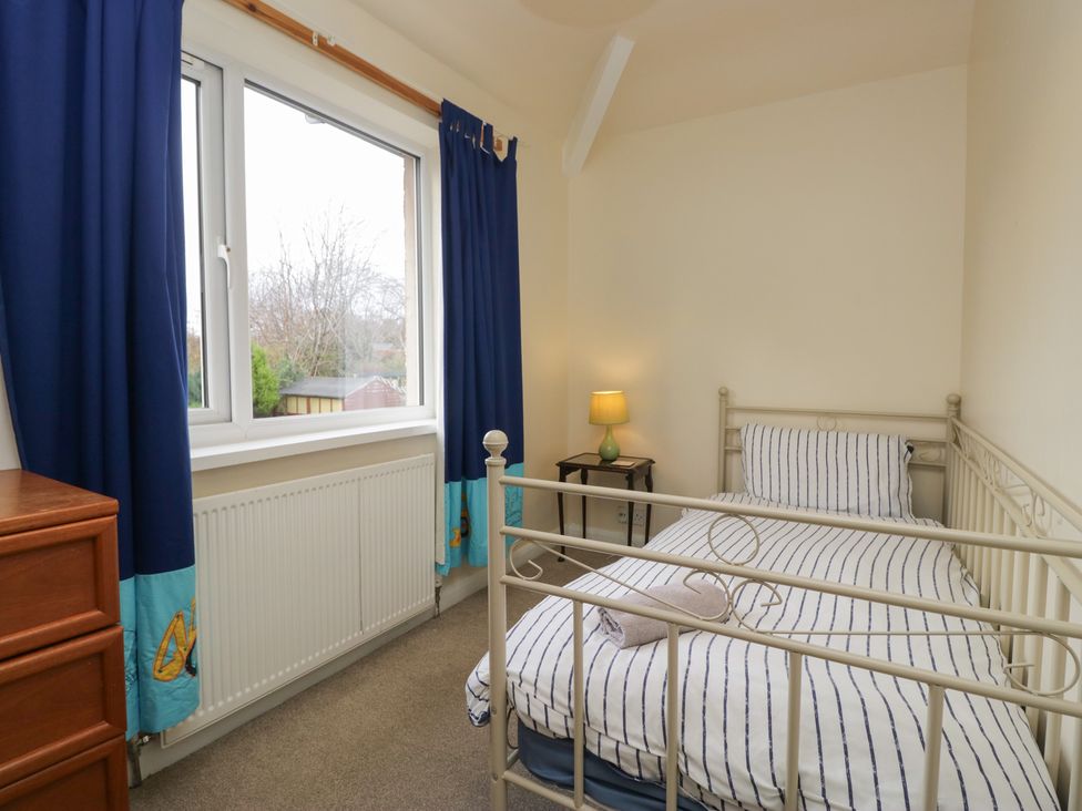 A bedroom with a single bed and a lamp at Castle Terrace in Penrith