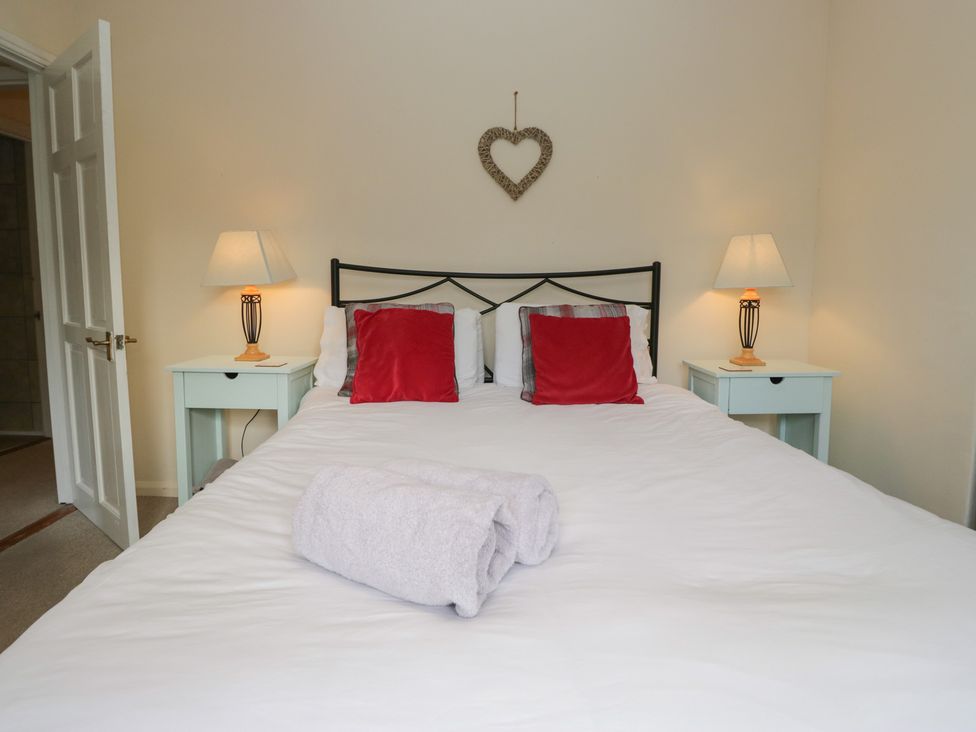 A bedroom with a bed and bedside tables at Castle Terrace in Penrith