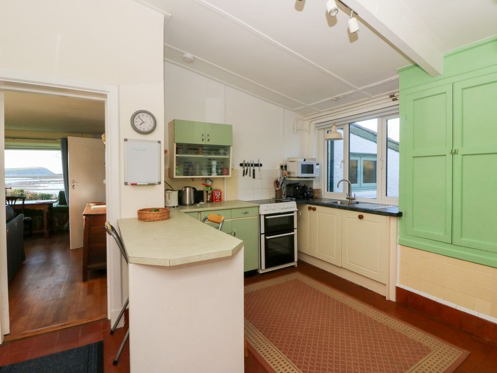 A kitchen with appliances and cabinets at Bryncyn in Newport, Pembrokeshire
