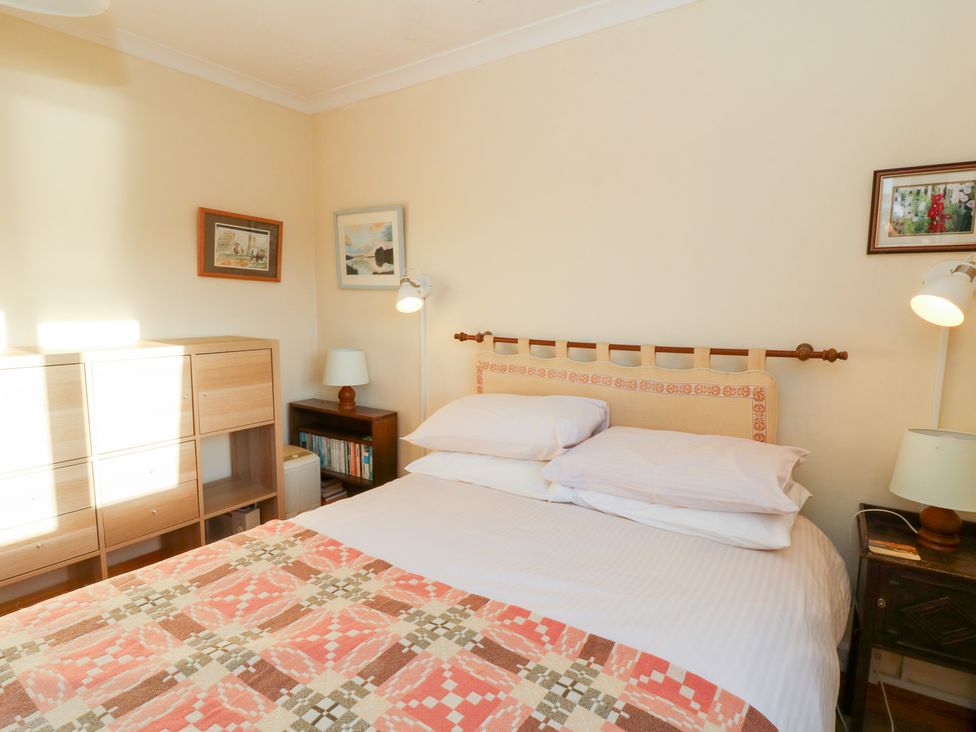A bedroom with a bed and furniture at Bryncyn, Newport, Pembrokeshire