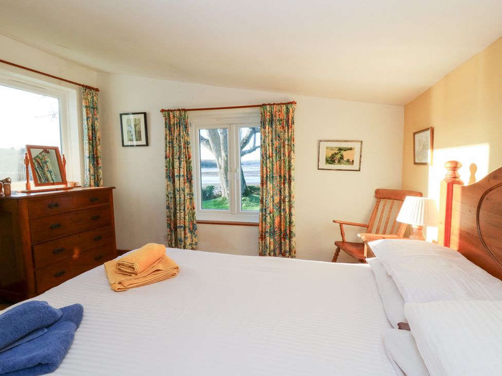 A bedroom with a bed and furniture at Bryncyn in Newport, Pembrokeshire
