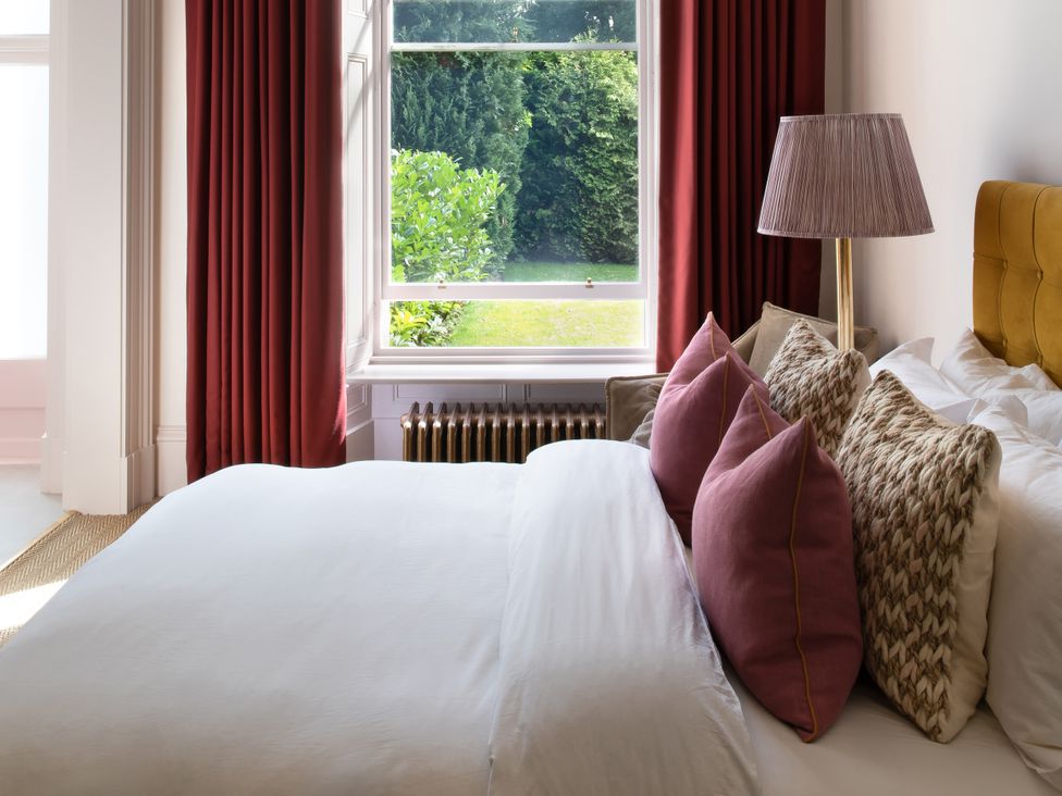 A bedroom with a bed and window at The Country House Cumbria, Castle Carrock