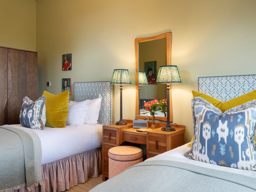 A bedroom with two beds and nightstands at The Country House Cumbria Castle Carrock