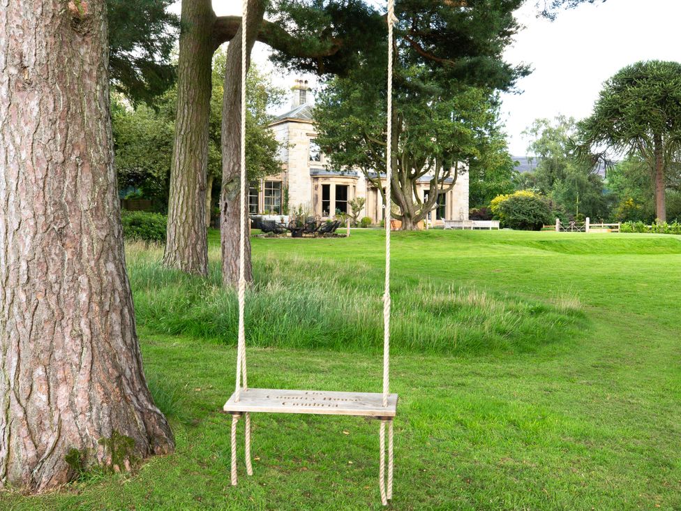 A swing in a garden at The Country House Cumbria Castle Carrock