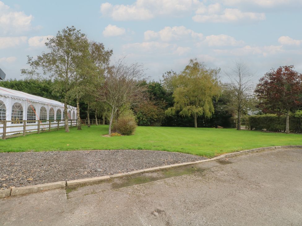 An outdoor area with a tent and trees at Pompian Lodge Leyland